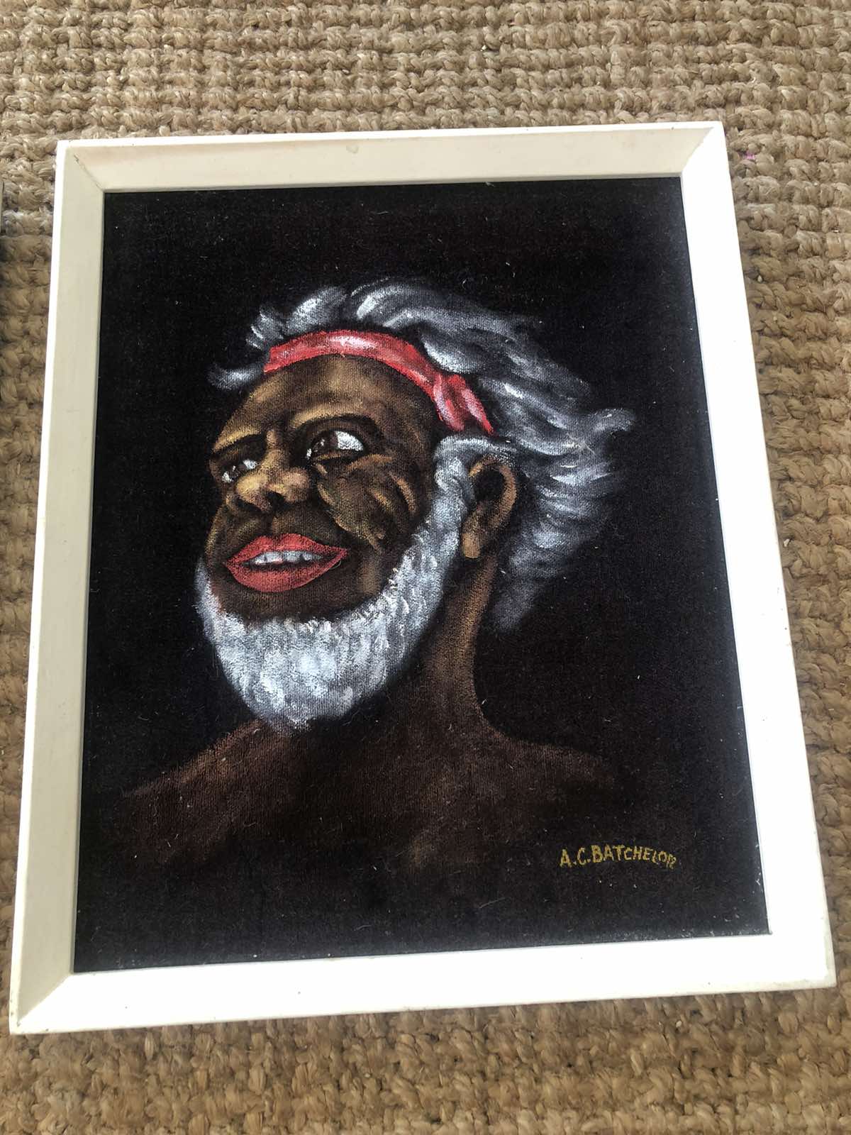 Pair of velvet paintings of indiginous subjects