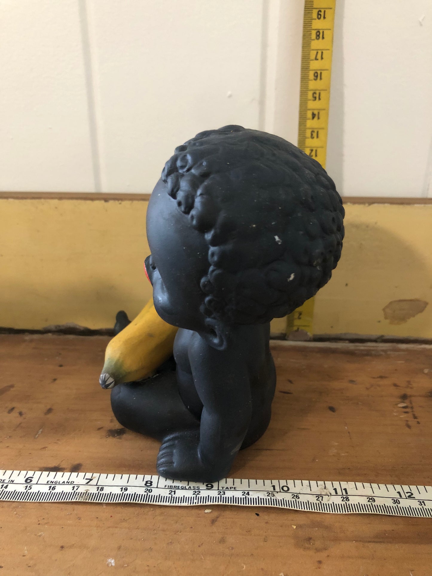 Baby with banana figurine. Black