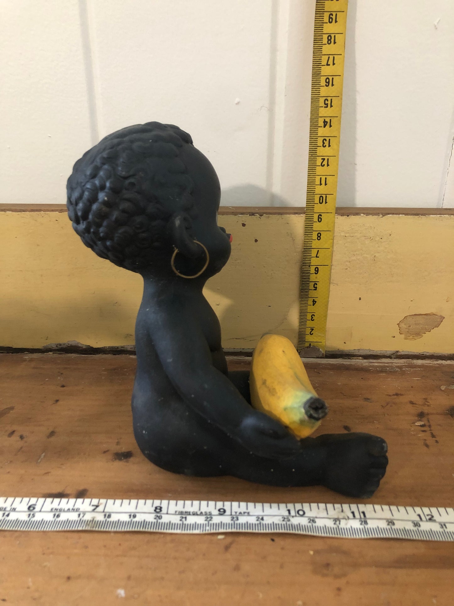 Baby with banana figurine. Black