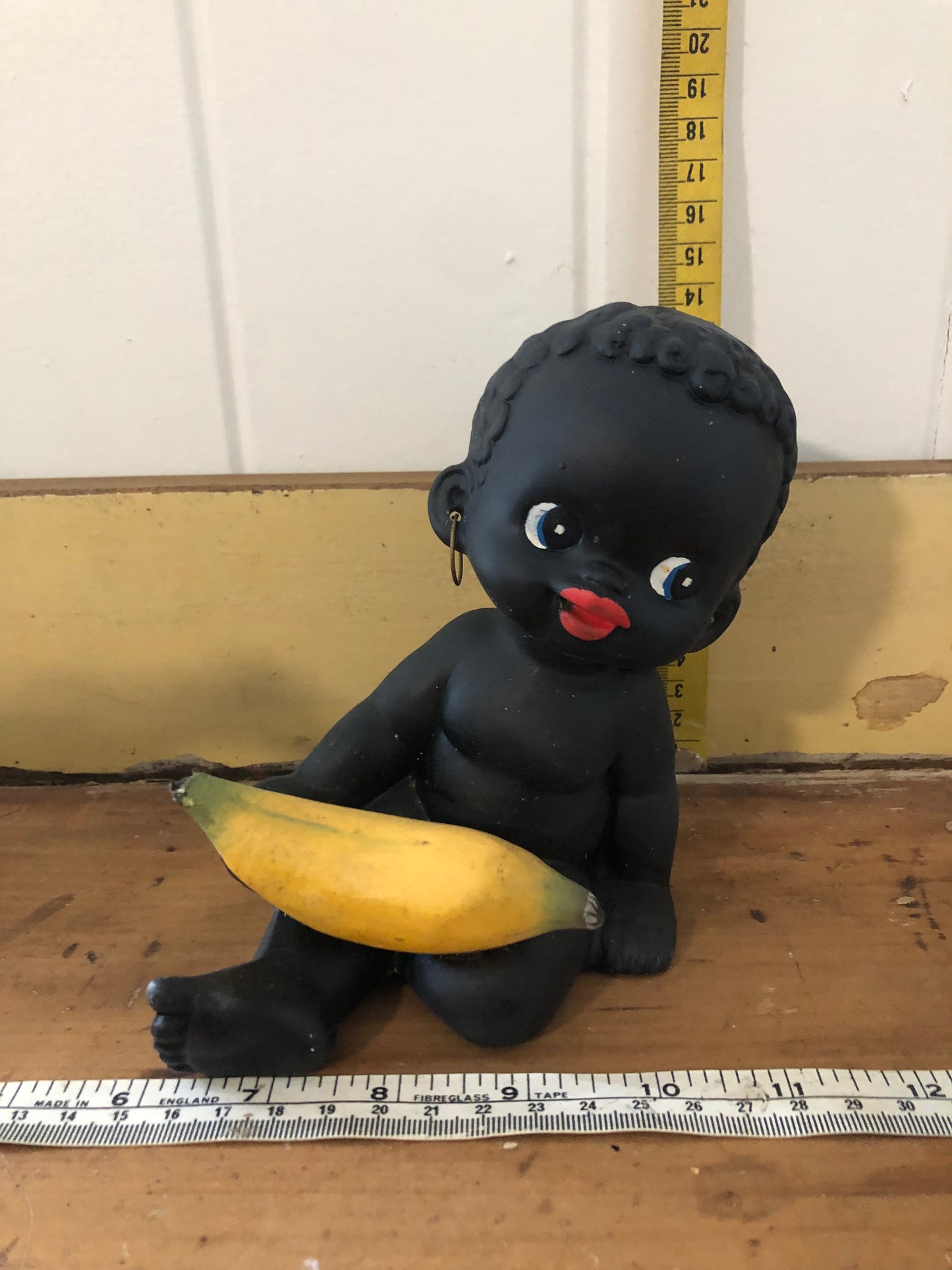 Baby with banana figurine. Black