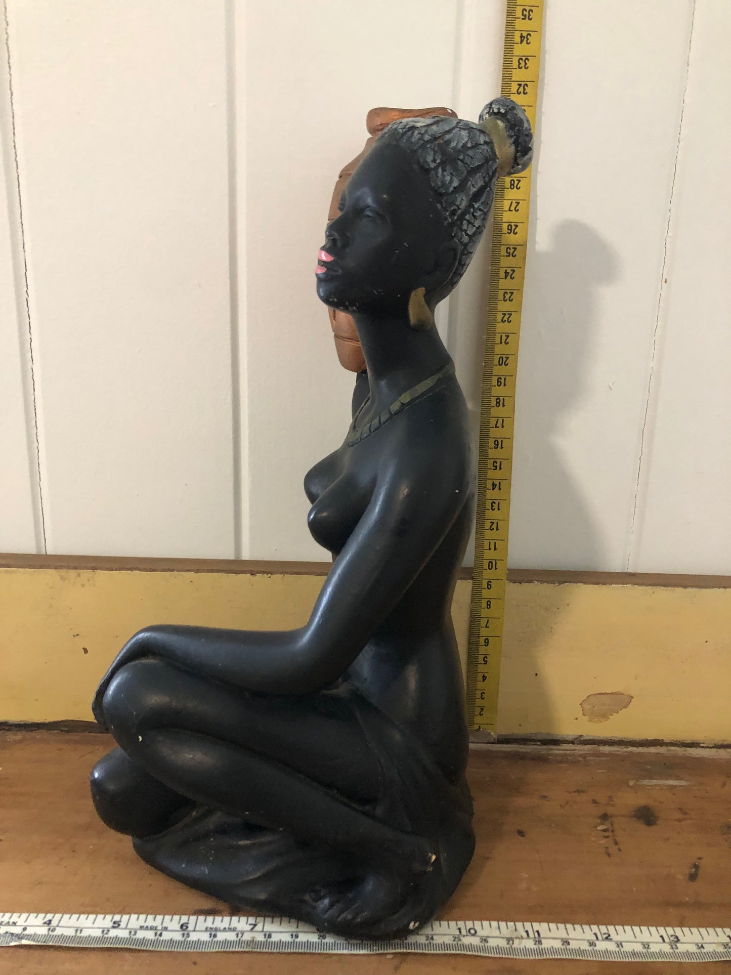 Lady with water jug. Black