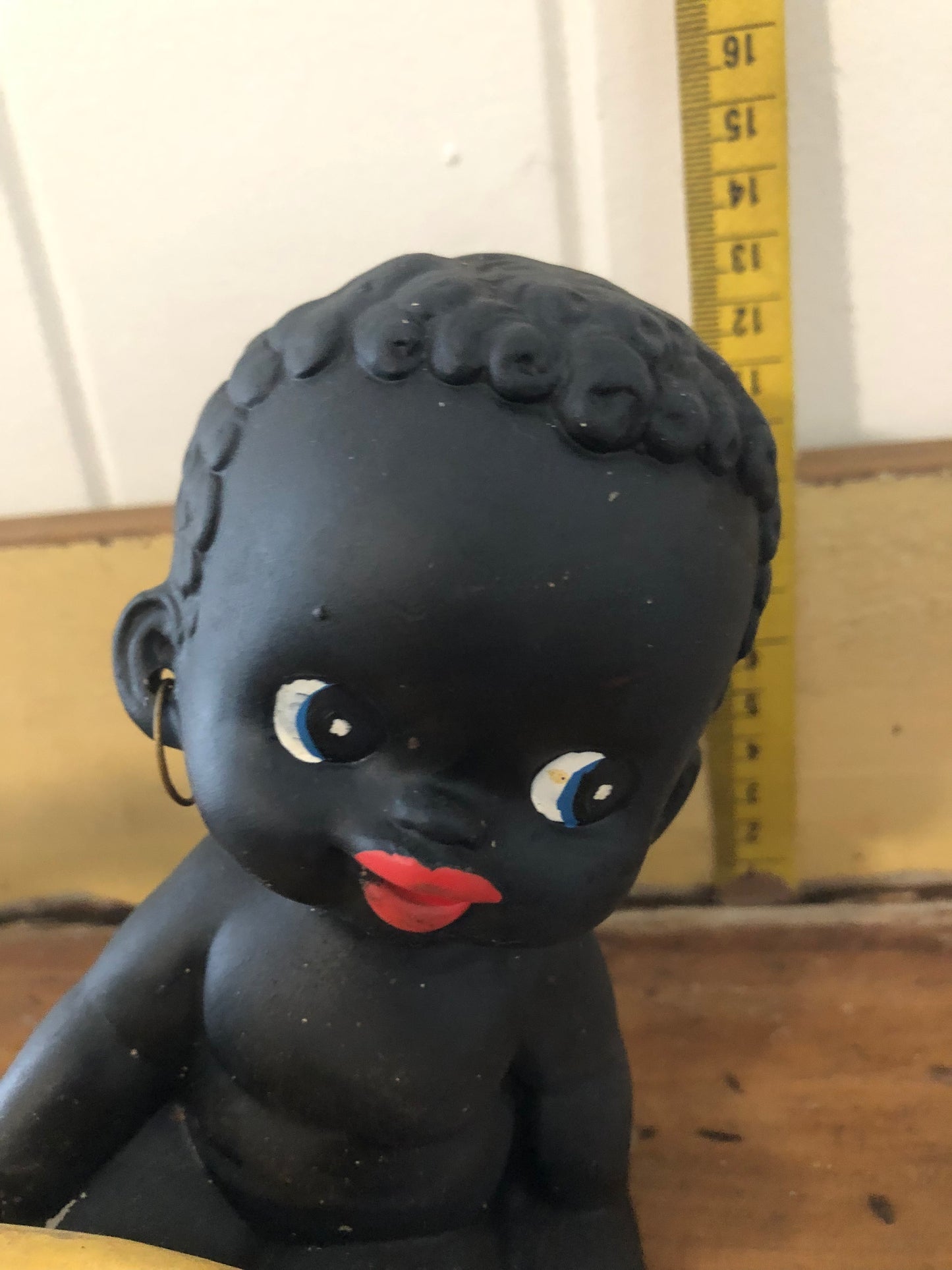 Baby with banana figurine. Black